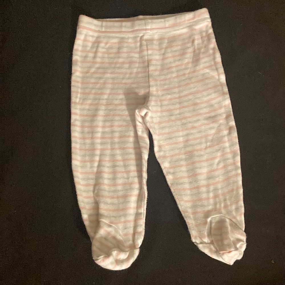 White pants with pink and gray stripes